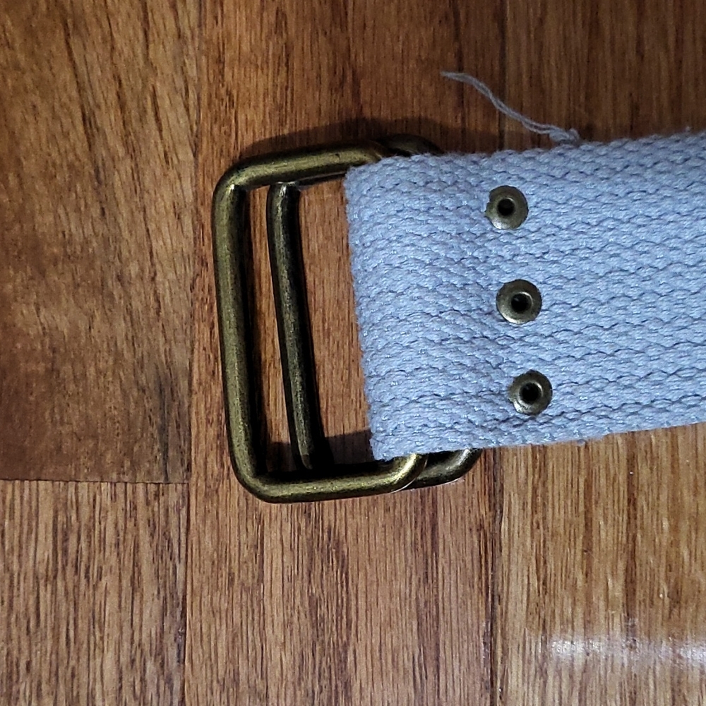 Distressed double hoop belt. Light grey in color